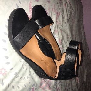 Black dress shoes. Has a wedge